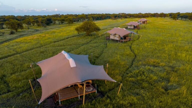 Luxury tent at Escarpment Serengeti Camp with panoramic savannah views